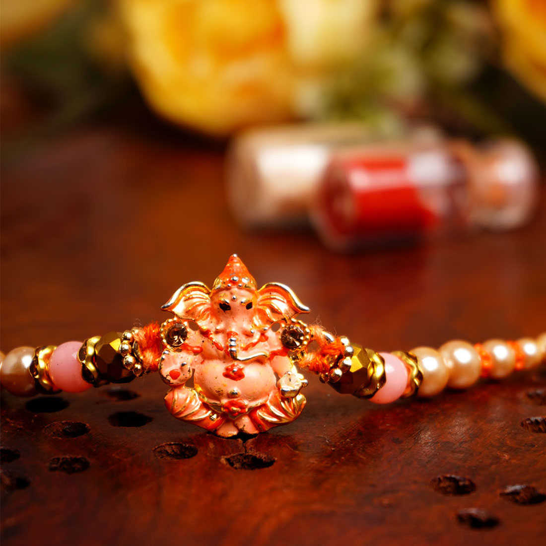 Urmika Shri Ganesh Beaded Rakhi with Roli Chawal