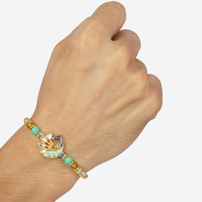 Urmika Green Peacock Rakhi with Roli Chawal