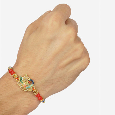 Urmika Colorful Peacock Rakhi with Red Thread with Roli Chawal