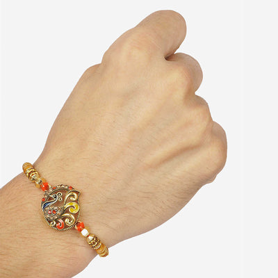 Urmika Shining Peacock Rakhi with Roli Chawal