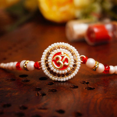 Urmika Om with white Pearl Rakhi with Roli Chawal