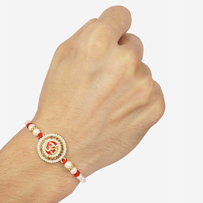 Urmika Om with white Pearl Rakhi with Roli Chawal