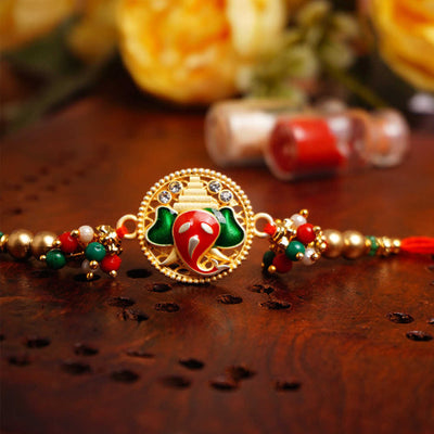 Urmika Red and Green Ganesha Rakhi with Roli Chawal