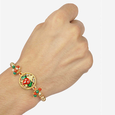 Urmika Red and Green Ganesha Rakhi with Roli Chawal