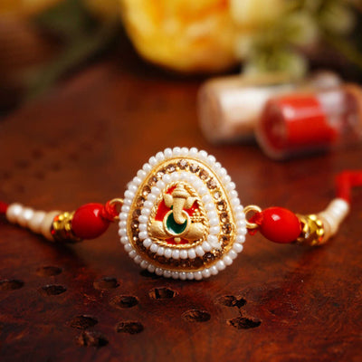 Urmika Ganesha with White Pearls with Roli Chawal