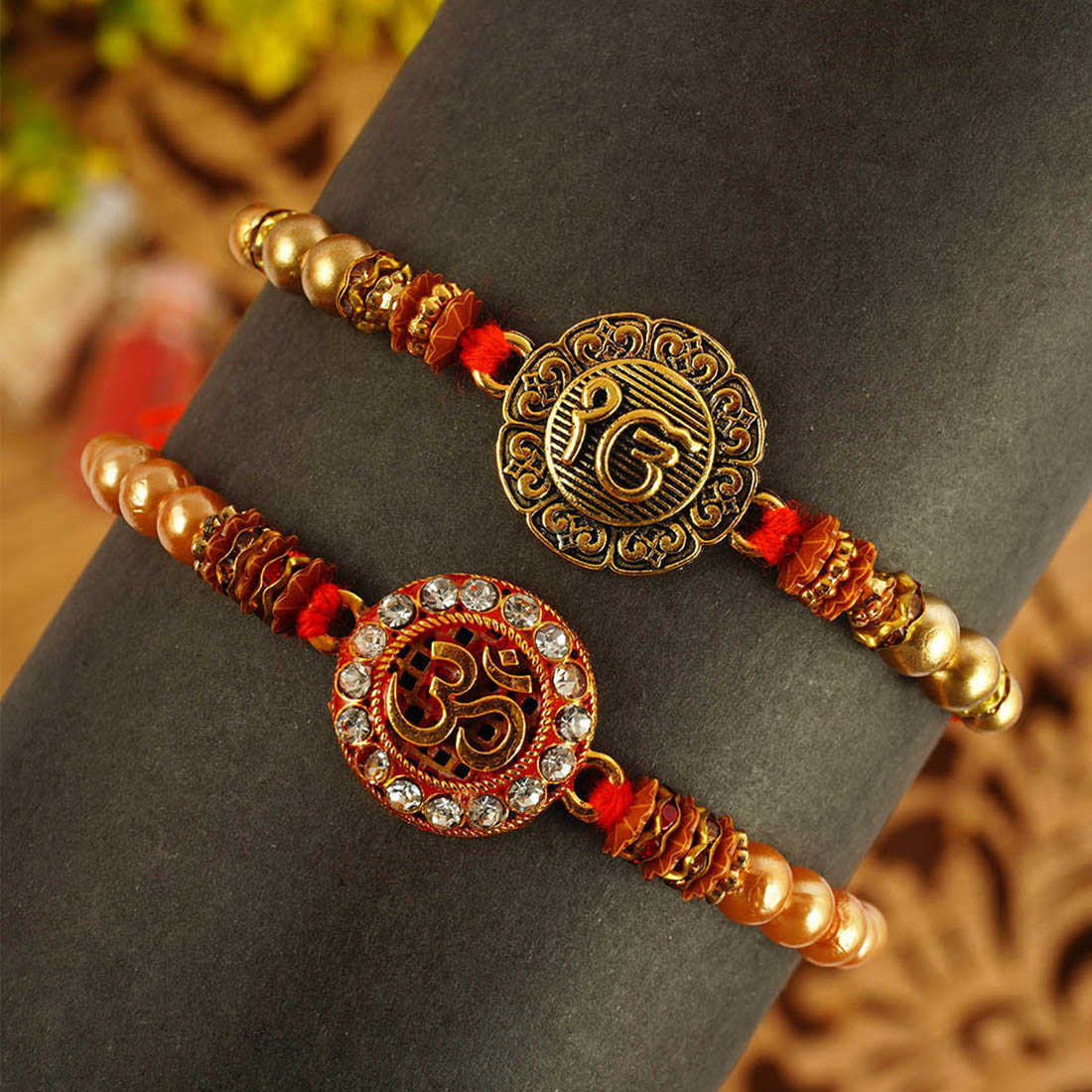 Urmika Ik Onkar and Om Rakhi Set of 2 with Roli Chawal