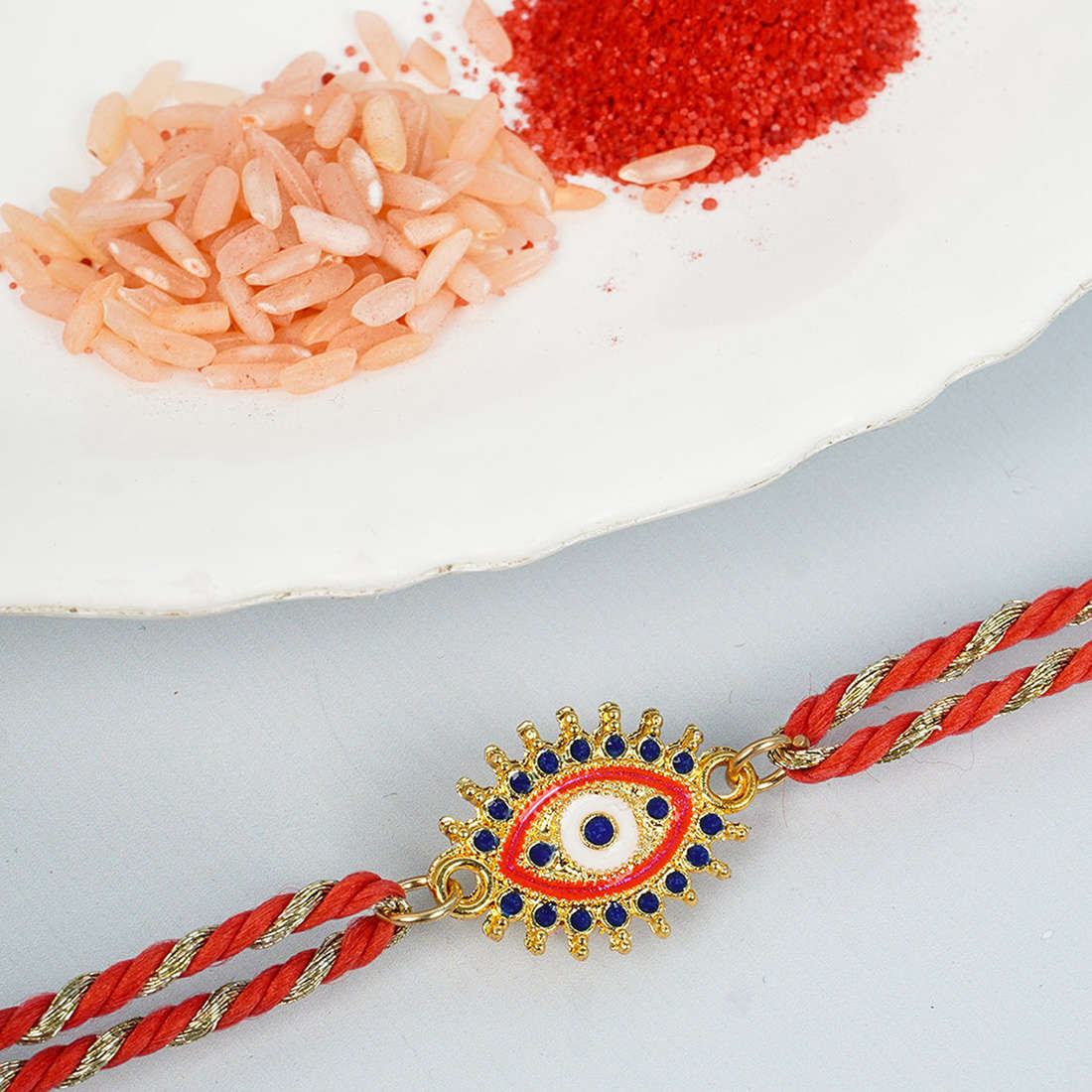Blue & Red Crystal Spiked Evil Eye Rakhi