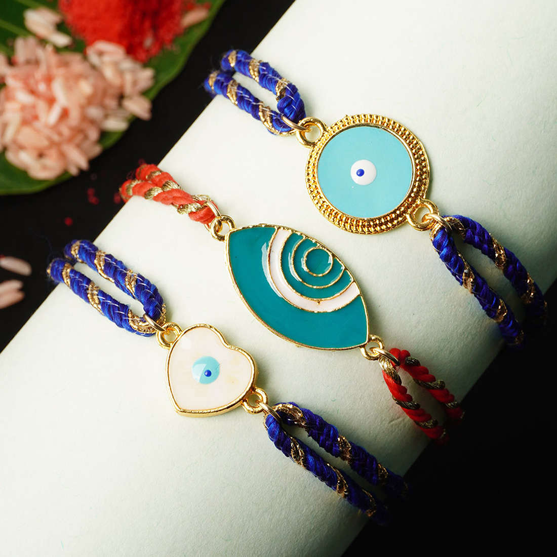 Blue & White Heart Disk Evil Eye Rakhi Set of Three