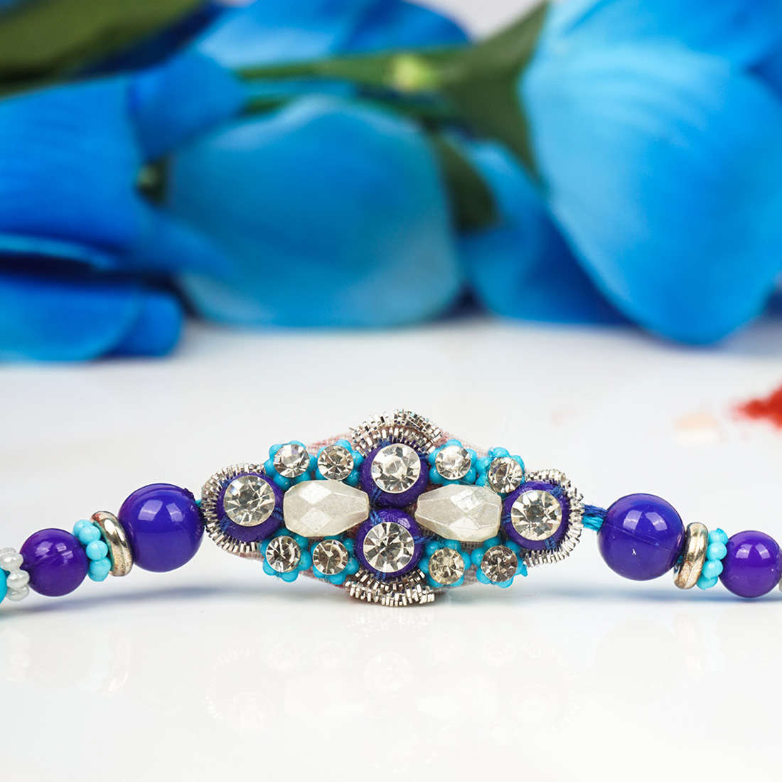 Crystal adorned Blue Beaded Evil Eye Rakhi
