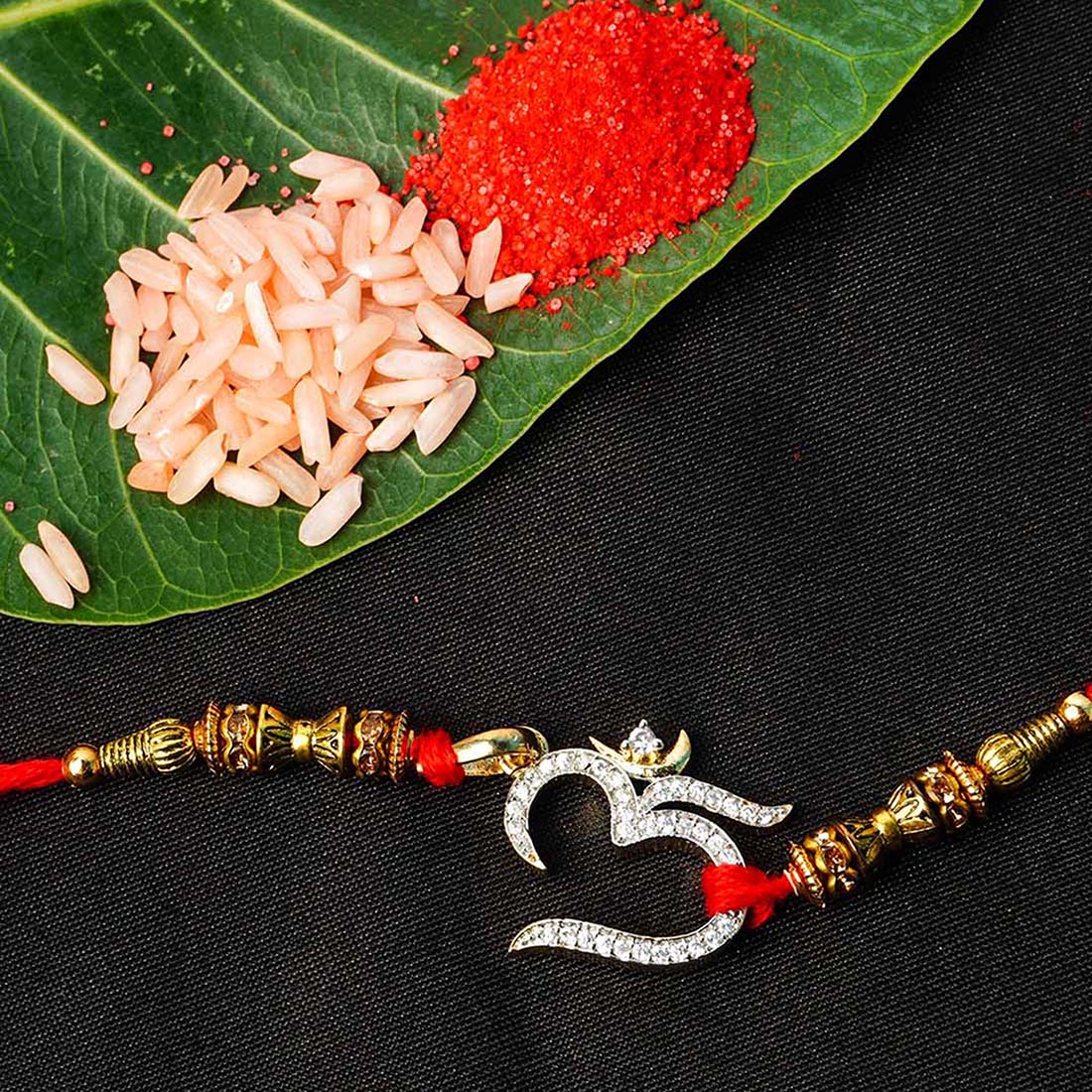 Crystal Studded Silver Om Religious Motif Rakhi