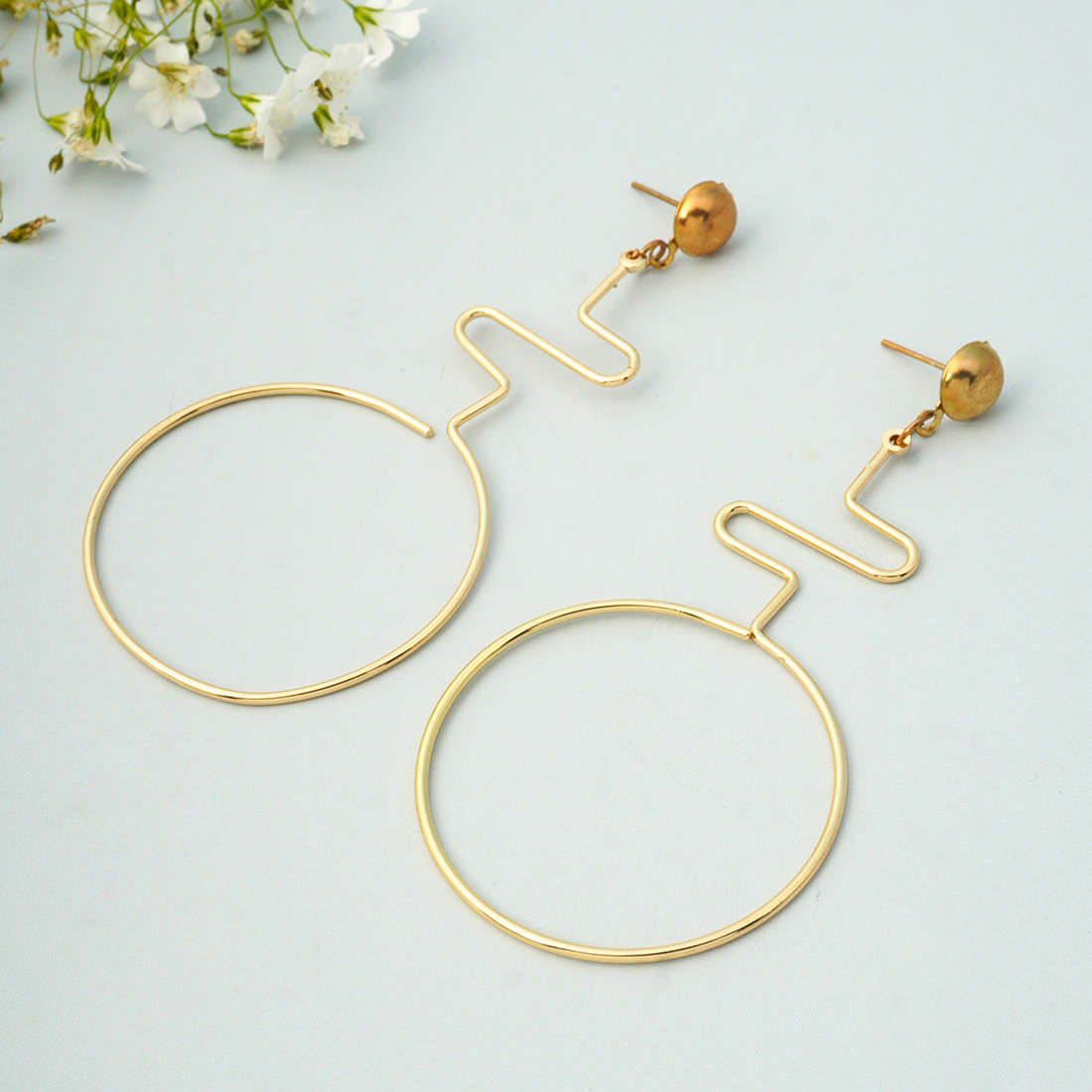 Gold Twisted Ring Danglers
