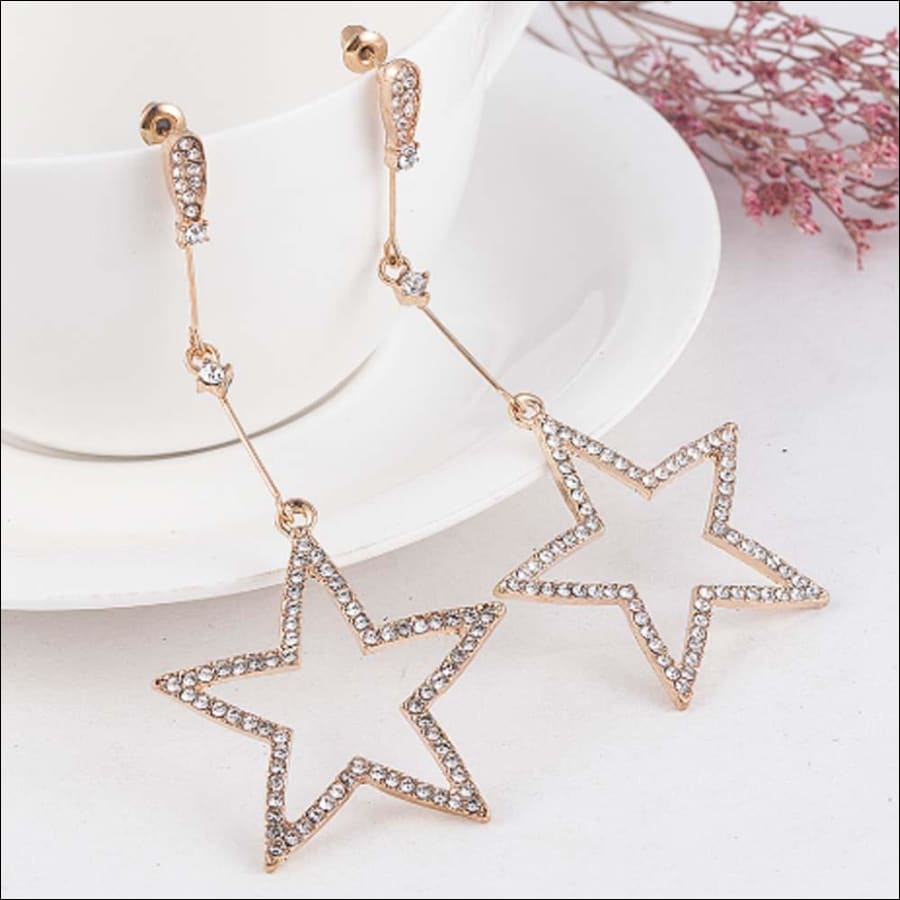 Golden dangling stars earrings