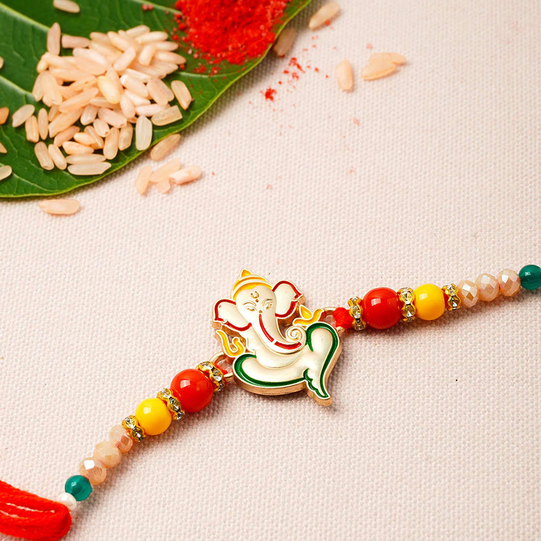 Shri Ganesh Red & Yellow Beaded Rakhi