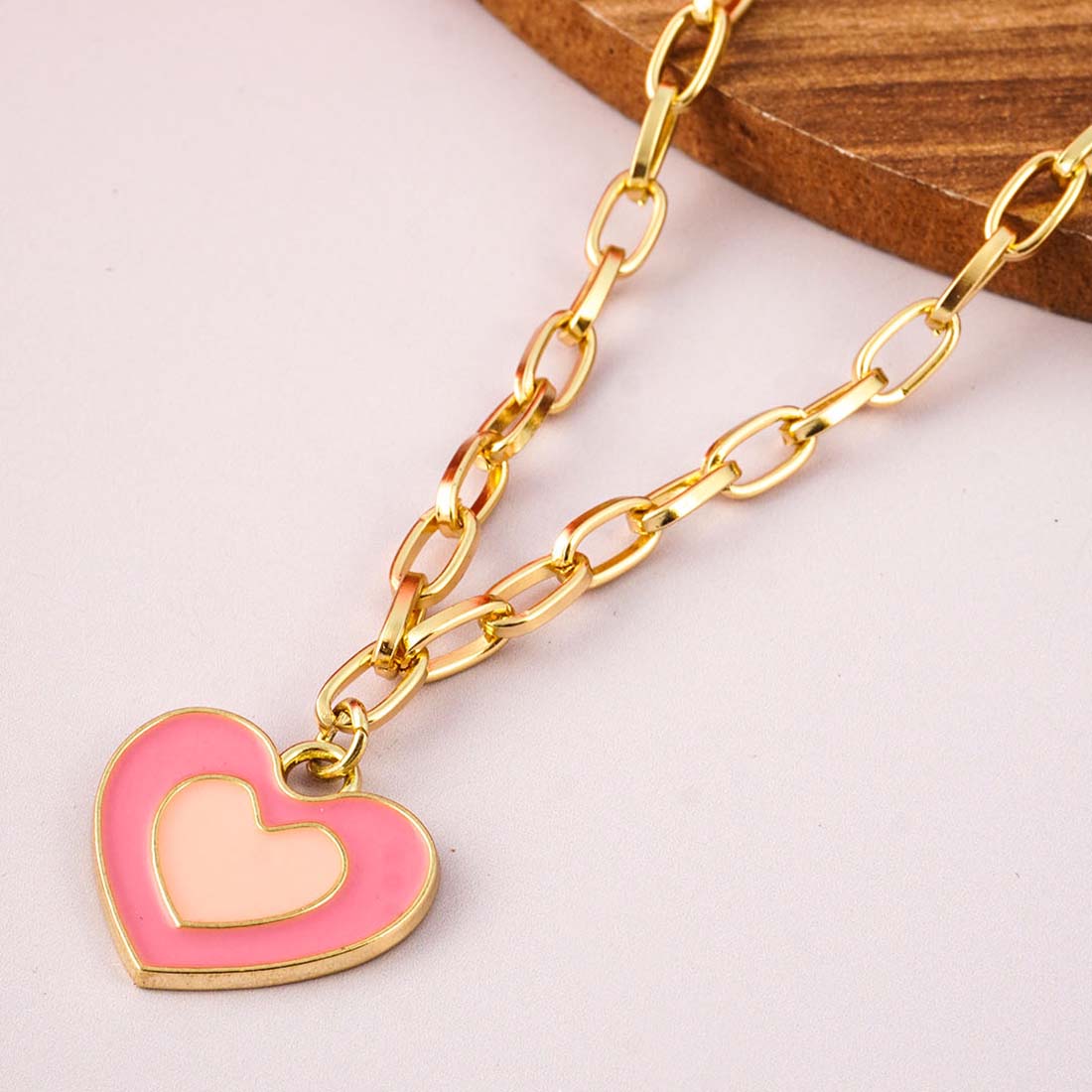 Women Gold-Toned & Pink Stone Studded Heart Shaped Pendant